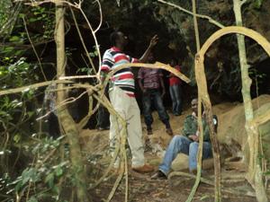 A section fo the group under a rock (nest) with the PI taking GPS coordinate.