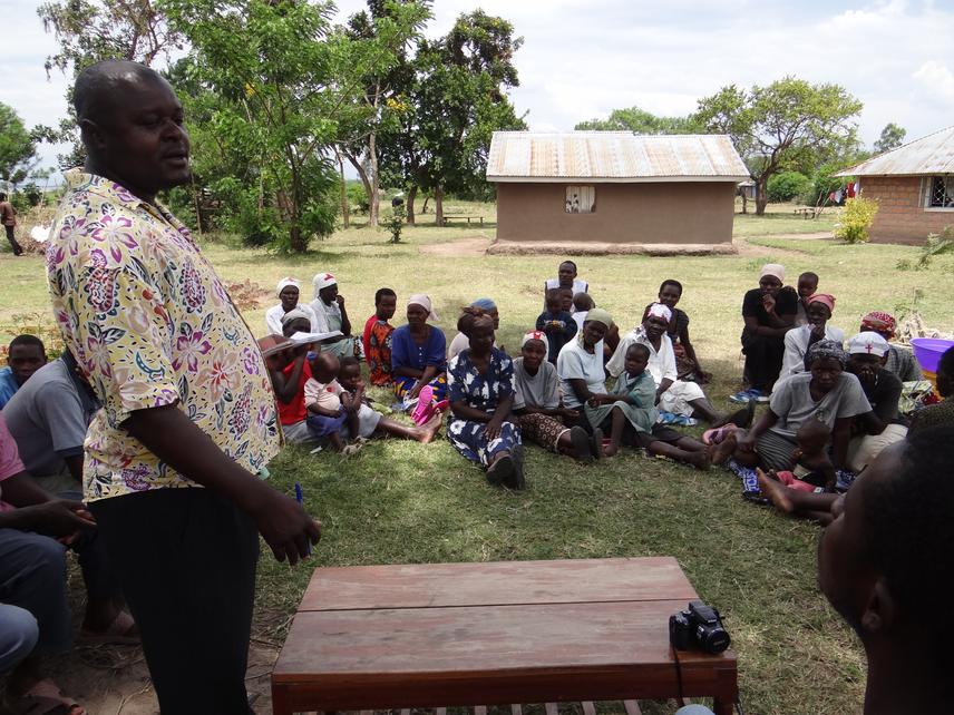 LVTOGA volunteers facilitate a meeting with the papyrus harvesters.