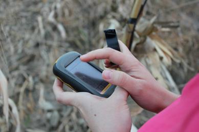 Taking coordinates in the field.