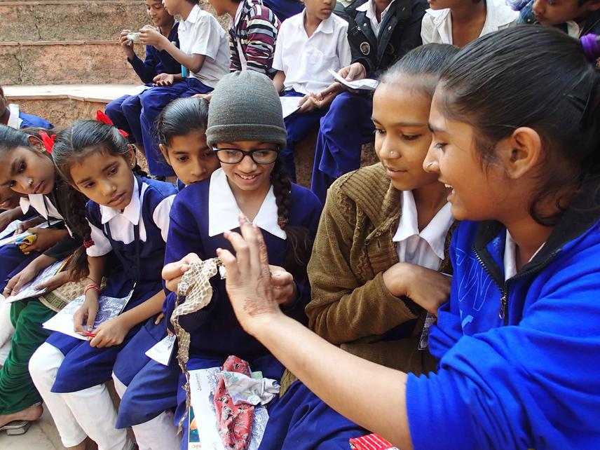 Students explore the slough of snake during one of the awareness programmes.