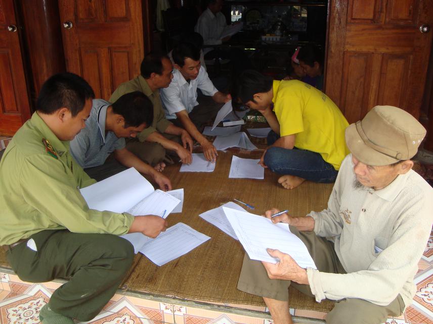 Elderly  man participating in meeting.