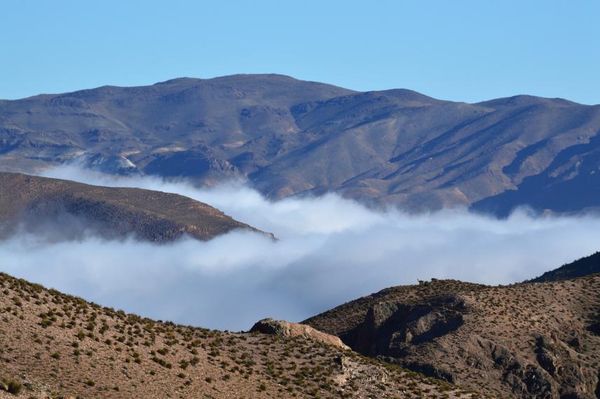Clouds trapped between the hills of the Pampa de Canota, Uspallata Mountains. (c) Bruno Alzugaray