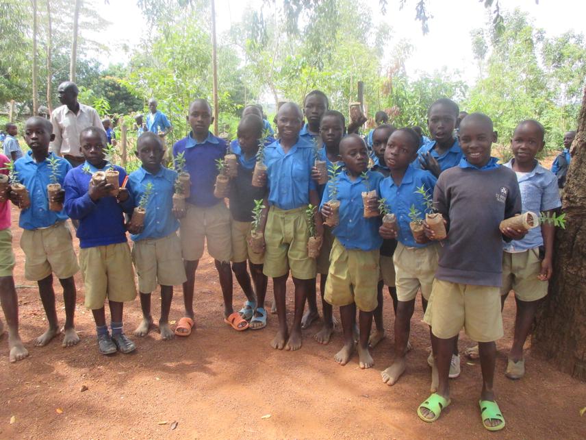 Environmental club members of Rapudo Primary with seedlings during school outreach
