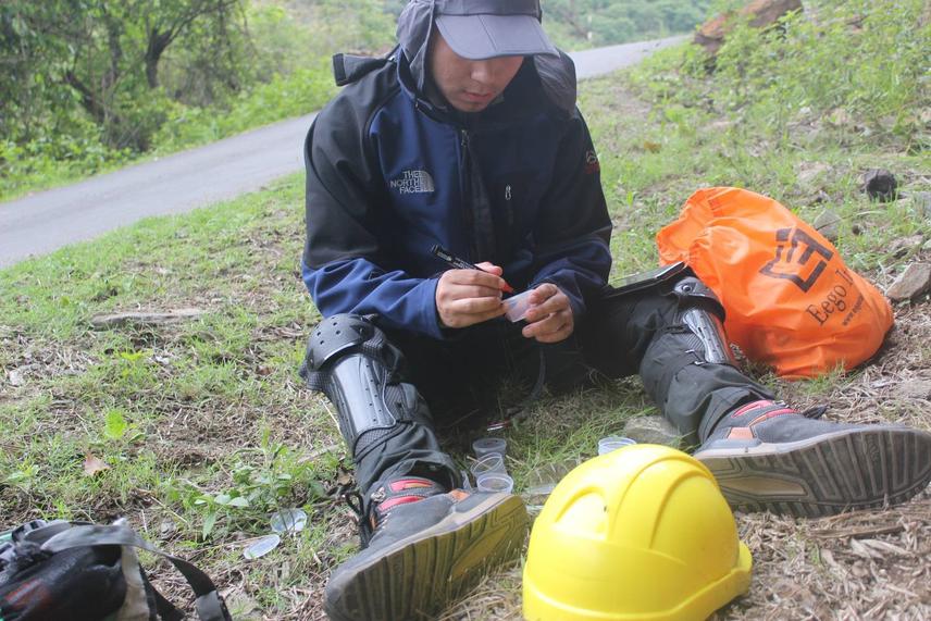 Field assistant labeling specimens collected during the field data collection.