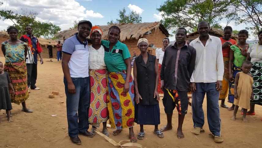 Andrew Chilombo with a community in Nyika Conservation Area.