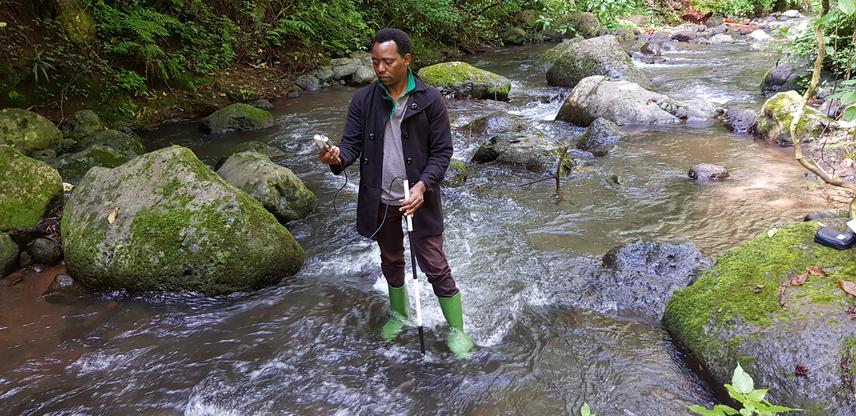 2Measuring flow rates in Simba river in the West Kilimanjaro ecosystem.