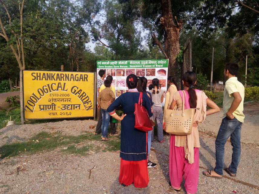 Locals observing our hoarding board.