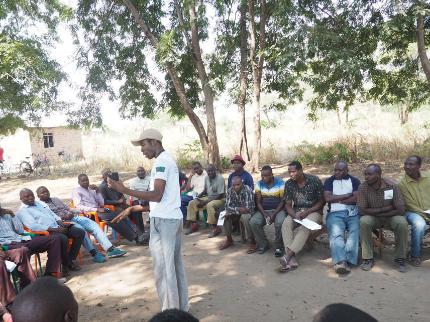 Jonathan Kwiyega elaborating some issues during Mwamatiga village(a in south of Mlele Game Reserve)  by-laws approval. © Neema Mwaja