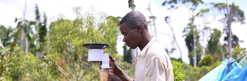 Field team implementing rain gauge ©2023 by Felaniaina Rafenoarisoa