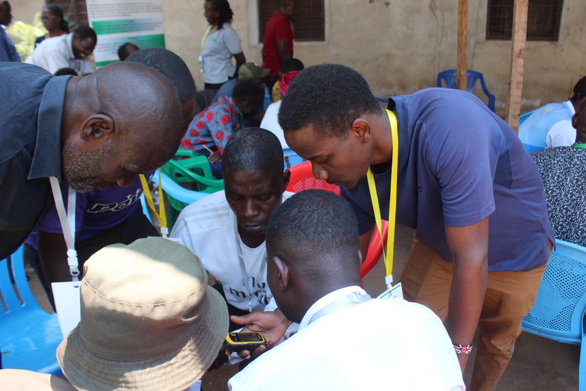 Benson Mremi explaining how to use GPS during LCA's training. © Elizabeth Mfumbilwa.