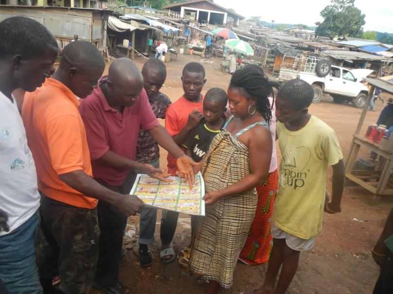 Mr. Sekou Kelleh, SADS Field Officer raising environmental awareness at Konia Market center.