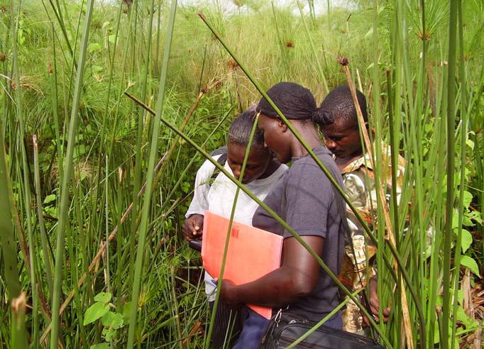 Survey and Monitoring Volunteers Learning how to Use GPS.