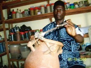 Tradipractitioner showing a chameleon as medicinal species.