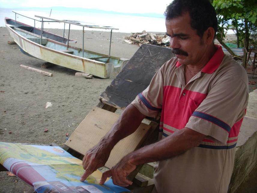 William Mata, project boat captain, with site map.