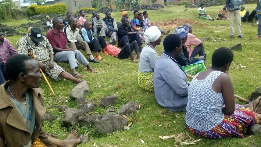 Community members listening to the bats conservation field staff on bats conservation © Nziza Julius