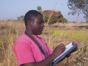 My helper Akwashiki recording observations.