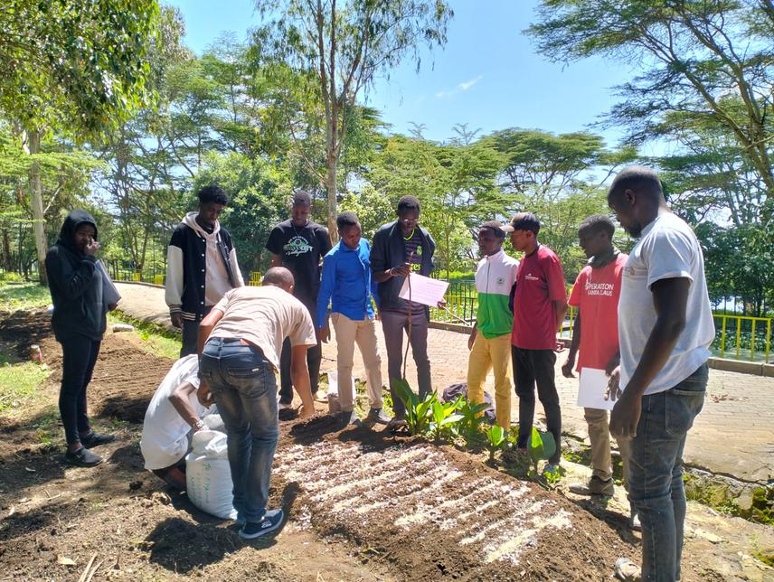 Training of Maasai Mara University members of wildlife and environmental club on tree nursery establishment. © Ouya, 2024.