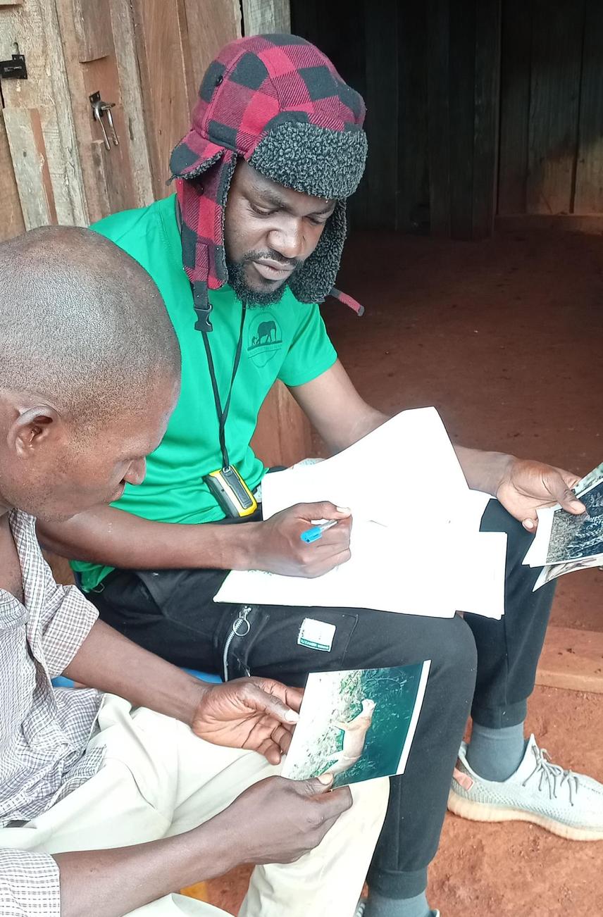 conducting surveys in local villages © Romaric Tegang